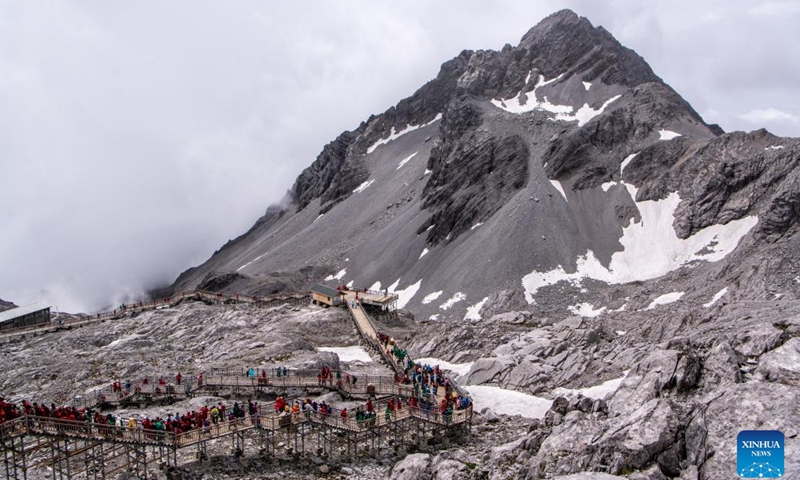 Tourists visit the scenic area of Yulong Snow Mountain in Lijiang City, southwest China's Yunnan Province, June 26, 2022.Photo:Xinhua