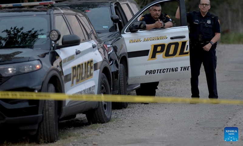 Police officers guard the scene of an alleged human smuggling mass casualty event in San Antonio, Texas, the United States, on June 28, 2022. The death toll of migrants found on Monday inside a cloned and abandoned 18-wheeler in San Antonio has risen to 50, authorities said on Tuesday.(Photo: Xinhua)