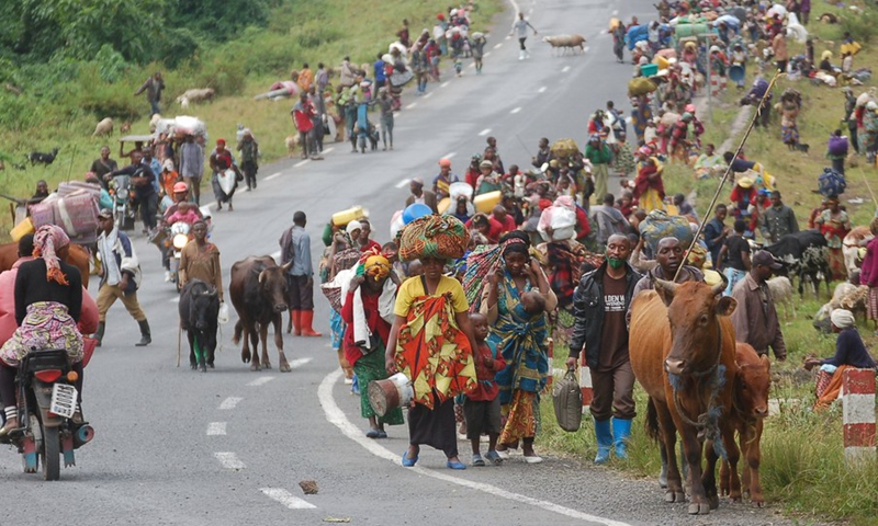 Photo taken on May 24, 2022 shows people fleeing due to the fighting between the Democratic Republic of the Congo (DRC) army and March 23 Movement (M23) rebels near the city of Goma, capital of North Kivu province of the DRC.(Photo: Xinhua)