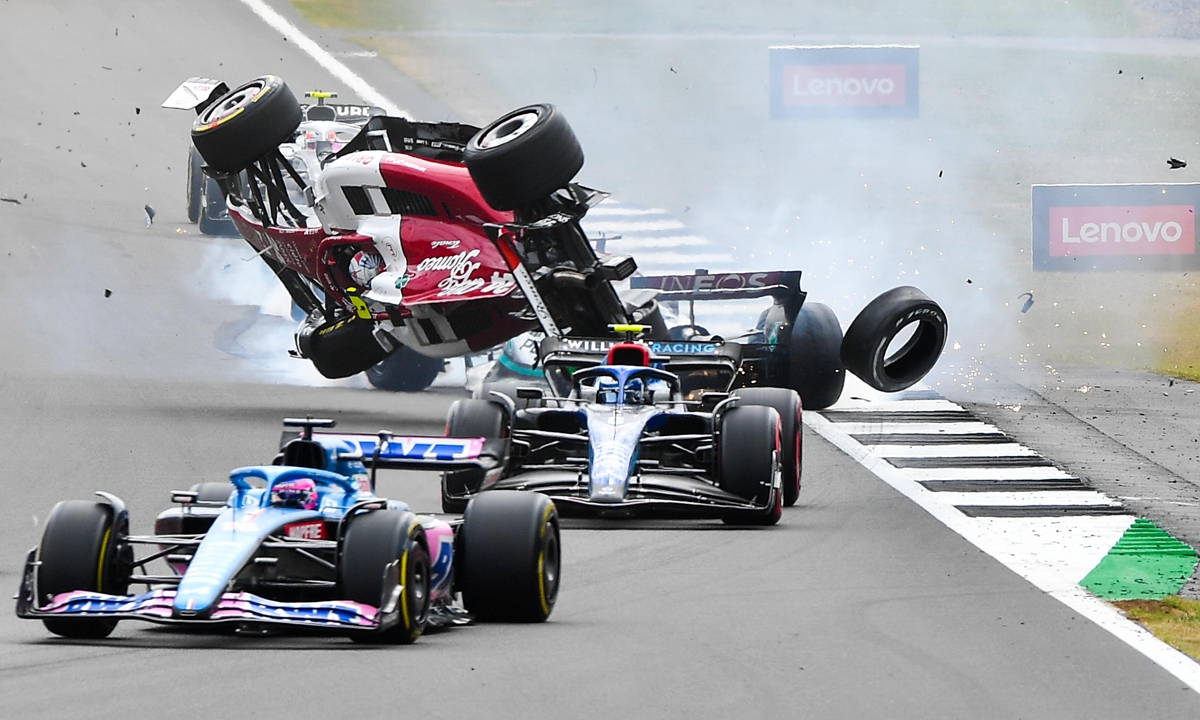 Zhou Guanyu crashes at the start during the F1 Grand Prix of Great Britain at Silverstone on July 3, 2022 in Northampton, England. Photo: IC