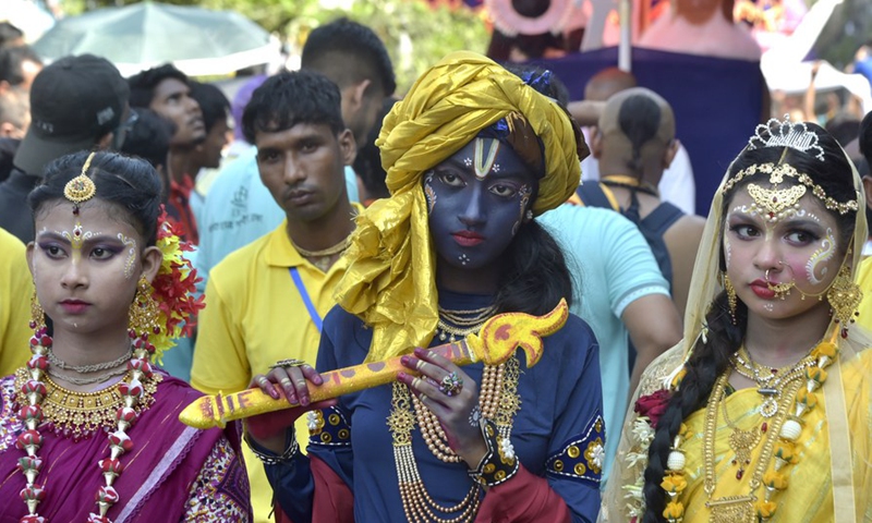 People in colorful costumes participate in a Rath Yatra Festival procession in Dhaka, Bangladesh on July 1, 2022.Photo:Xinhua