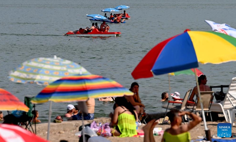 People enjoy their leisure time at Dojran Lake in Dojran, North Macedonia on July 3, 2022.Photo:Xinhua