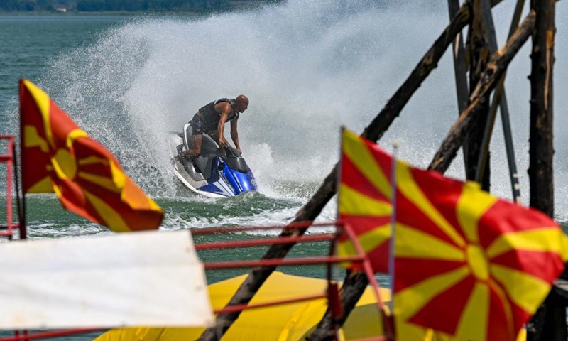 A tourist rides a water scooter at Dojran Lake in Dojran, North Macedonia on July 3, 2022.Photo:Xinhua