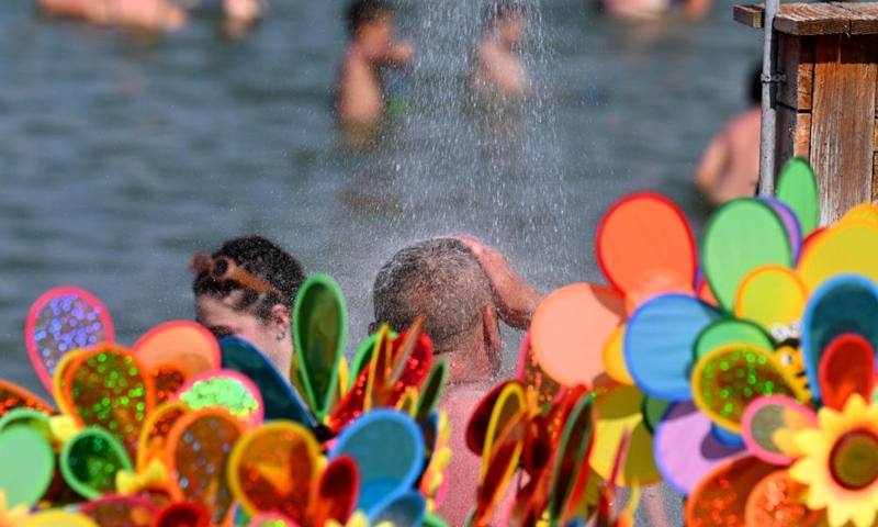 People enjoy their leisure time at Dojran Lake in Dojran, North Macedonia on July 3, 2022.Photo:Xinhua