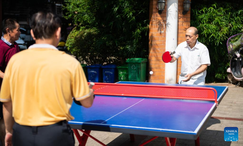 Senior citizens play table tennis at a community-based day-care center in Hanshou County, central China's Hunan Province, July 20, 2022. (Xinhua/Chen Sihan)