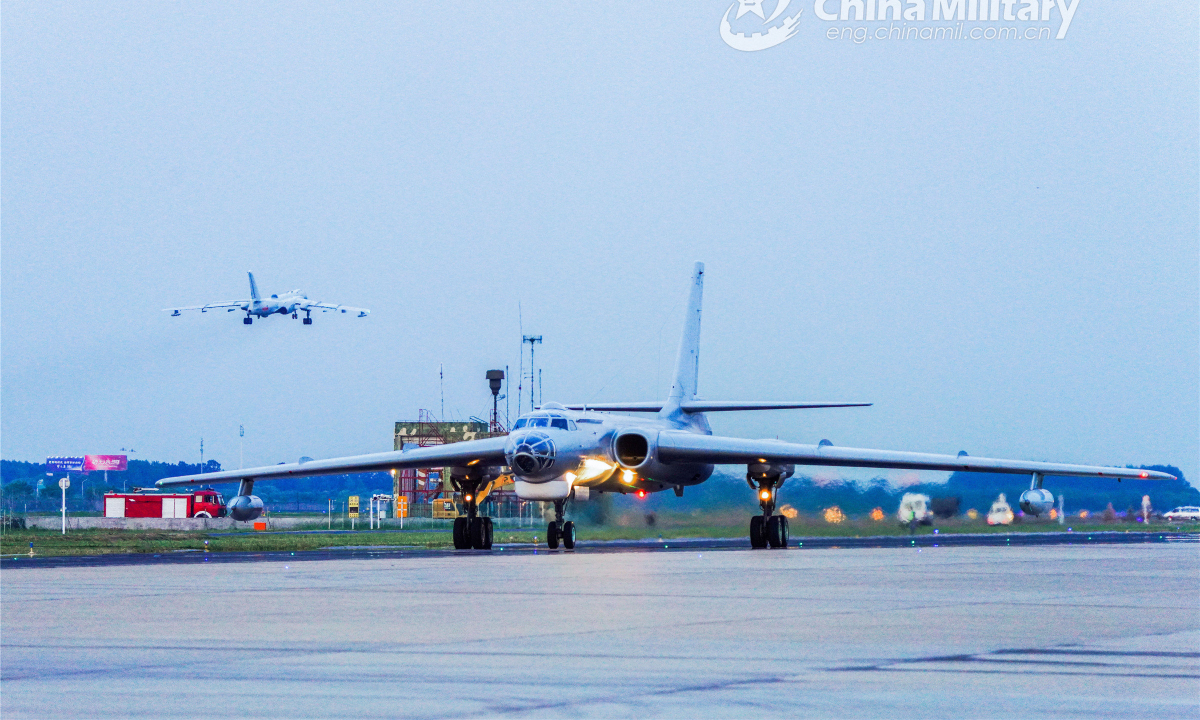 An H6 bomber attached to an aviation regiment with the navy under PLA Eastern Theatre Command taxis on the runway during a round-the-clock flight training exercise on June 15, 2022. Photo:China Military