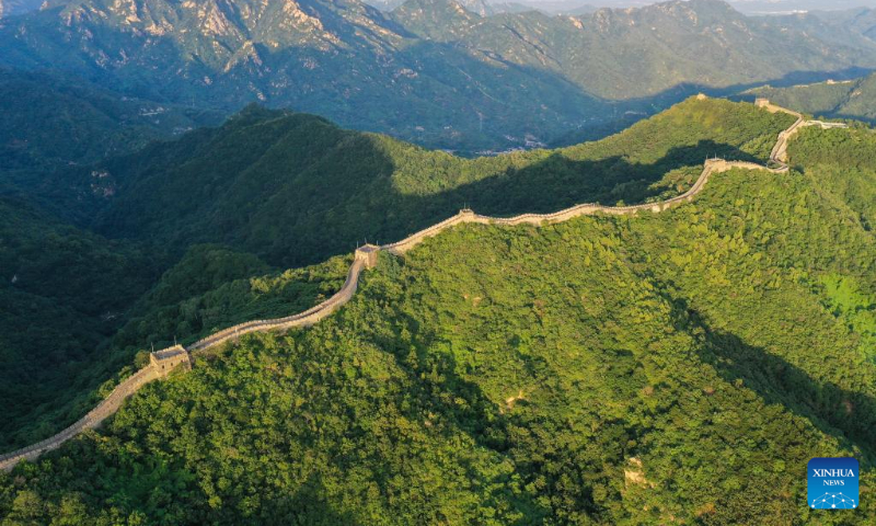 Aerial photo taken on July 10, 2022 shows the sunset scenery of the Mutianyu section of the Great Wall in Beijing, capital of China. (Xinhua/Chen Yehua)