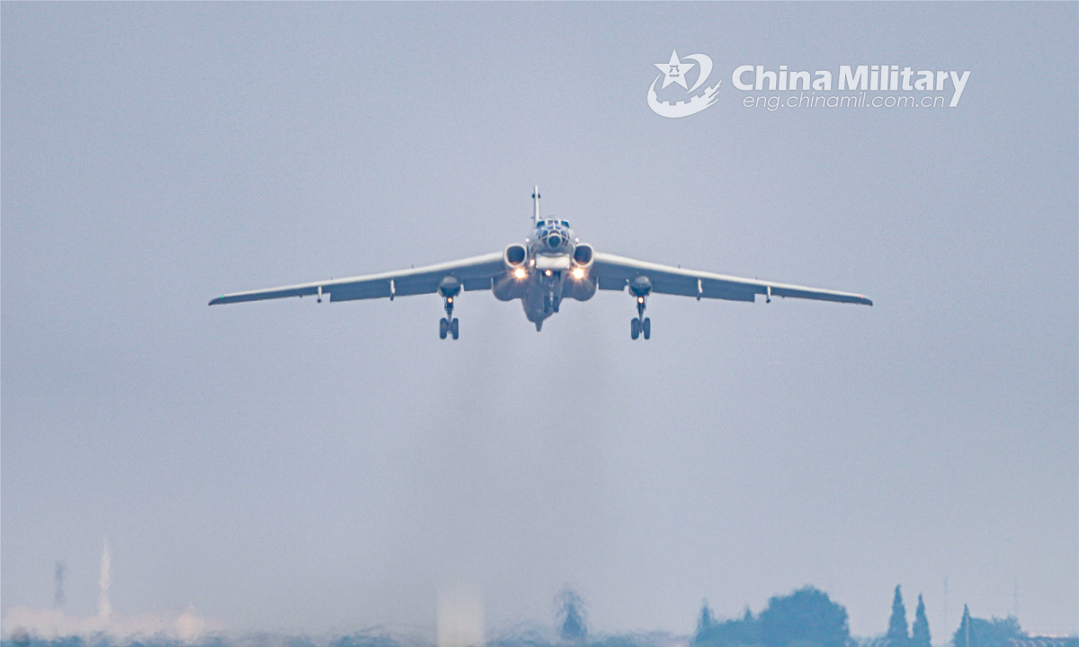 An H6 bomber attached to an aviation regiment with the navy under PLA Eastern Theatre Command prepares to land on the runway during a round-the-clock flight training exercise on June 15, 2022.  Photo:China Military