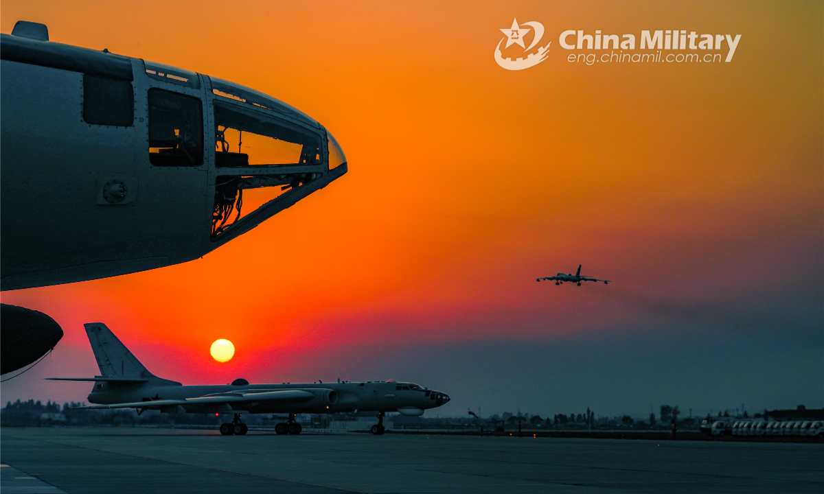 Two H6 bombers attached to an aviation regiment with the navy under PLA Eastern Theatre Command see off another warplane during a round-the-clock flight training exercise on June 15, 2022. Photo:China Military