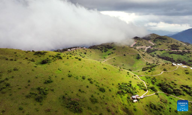 Aerial photo shows the grassland scenery of Bashan Mountain in Langao County, northwest China's Shaanxi Province, July 13, 2022. (Xinhua/Tao Ming)