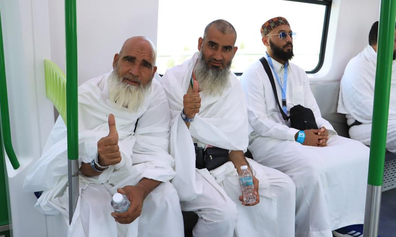 Pilgrims give thumbs up to the fast and convenient services of the Mecca light rail trains in Mecca, Saudi Arabia, July 9, 2022.(Photo: Xinhua)