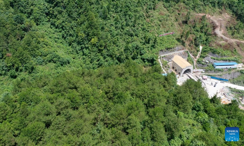 Aerial photo taken on July 13, 2022 shows the Qingmiaozhai tunnel of the Guiyang-Nanning high-speed railway in southwest China's Guizhou Province. The Qingmiaozhai tunnel was through on Wednesday, which was the lastly drilled through one among all 63 tunnels on the Guiyang-Nanning high-speed railway designed with a maximum speed of 350 km per hour.(Photo: Xinhua)