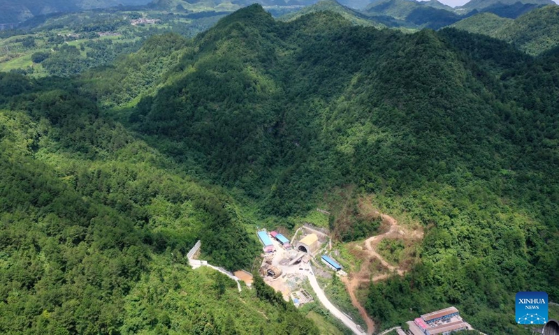 Aerial photo taken on July 13, 2022 shows the Qingmiaozhai tunnel of the Guiyang-Nanning high-speed railway in southwest China's Guizhou Province. The Qingmiaozhai tunnel was through on Wednesday, which was the lastly drilled through one among all 63 tunnels on the Guiyang-Nanning high-speed railway designed with a maximum speed of 350 km per hour.(Photo: Xinhua)