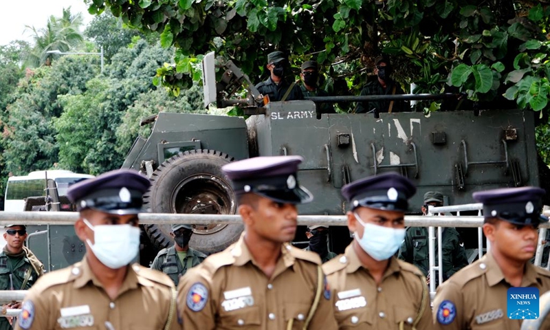 Military and police officers stand guard outside the Sri Lankan parliament in Colombo, Sri Lanka, July 20, 2022. Acting President Ranil Wickremesinghe was elected as the new president of Sri Lanka in an election held in parliament on Wednesday.(Photo: Xinhua)