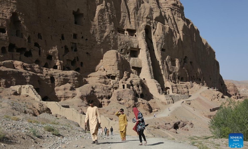 Tourists visit the site of the giant Buddha ruins in Bamiyan province, Afghanistan, July 10, 2022. Once a popular destination for tourists, Afghanistan's central Bamiyan province has been gradually recovering from the war aftermath to attract sightseers, but the scarcity of accommodations has become a new problem.(Photo: Xinhua)