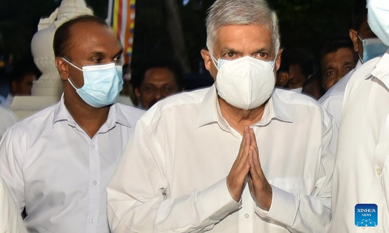 Ranil Wickremesinghe (C) visits a Buddhist temple in Colombo, Sri Lanka, on July 20, 2022. Acting President Ranil Wickremesinghe was elected as the new president of Sri Lanka in an election held in parliament on Wednesday.(Photo: Xinhua)