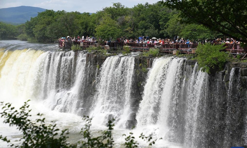 Photo taken on July 13, 2022 shows scenery of Diaoshuilou waterfall at the Jingpohu Global Geopark in Mudanjiang City, northeast China's Heilongjiang Province.Photo:Xinhua