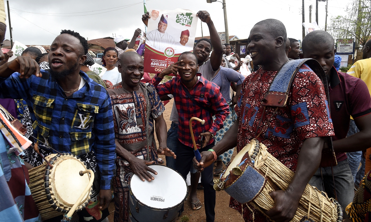 Supporters dance to drumming to celebrate the victory of the opposition People's Democratic Party candidate, Ademola Adeleke, following the conclusion of the gubernatorial election at Ido Oshun, Osun State in southwest Nigeria, on July 17, 2022. Photo: AFP