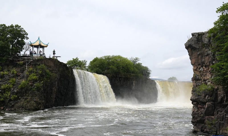 Photo taken on July 13, 2022 shows scenery of Diaoshuilou waterfall at the Jingpohu Global Geopark in Mudanjiang City, northeast China's Heilongjiang Province.Photo:Xinhua