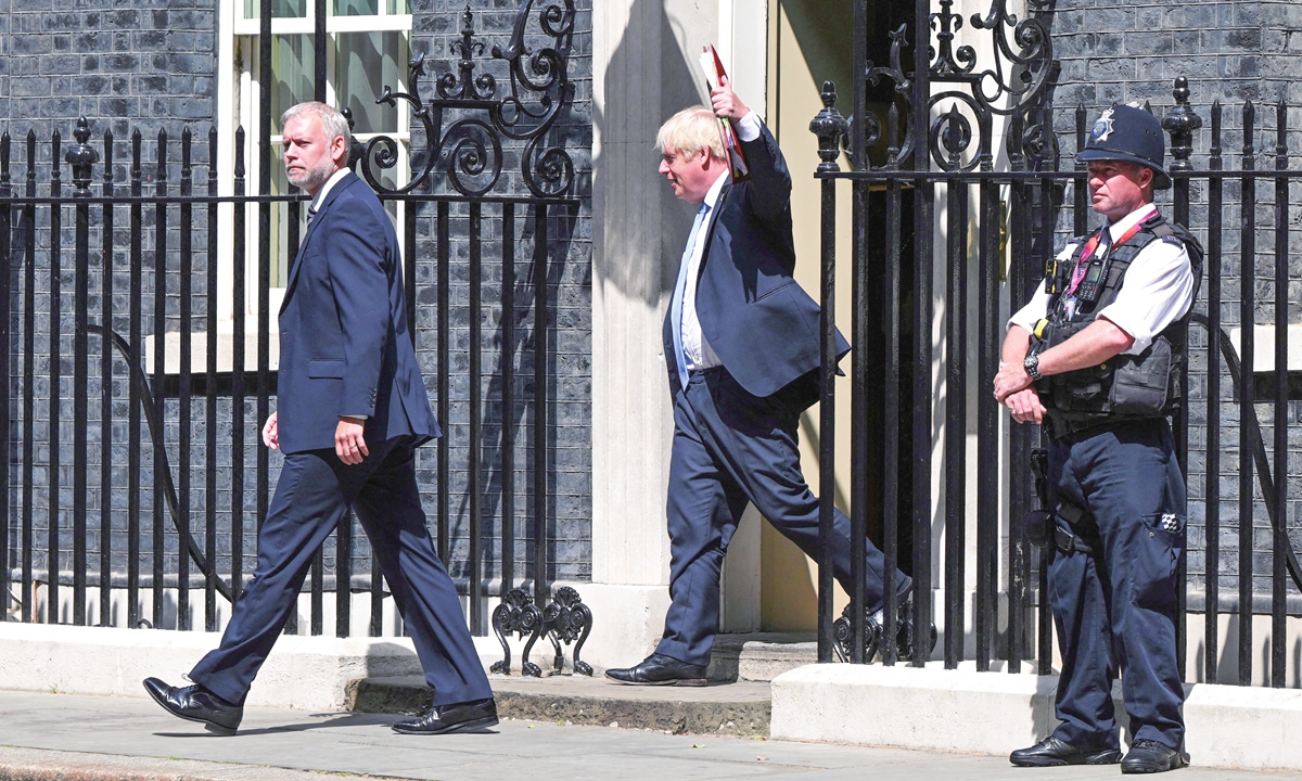 Britain's Prime Minister Boris Johnson reacts as he leaves 10 Downing Street in central London on July 20, 2022 to head to the Houses of Parliament for his last weekly Prime Minister's Questions (PMQs) session. The final two candidates to become UK prime minister were decided after PMQs, with Foreign Secretary Liz Truss battling it out in a run off with former chancellor of the exchequer and frontrunner Rishi Sunak. Photo: AFP