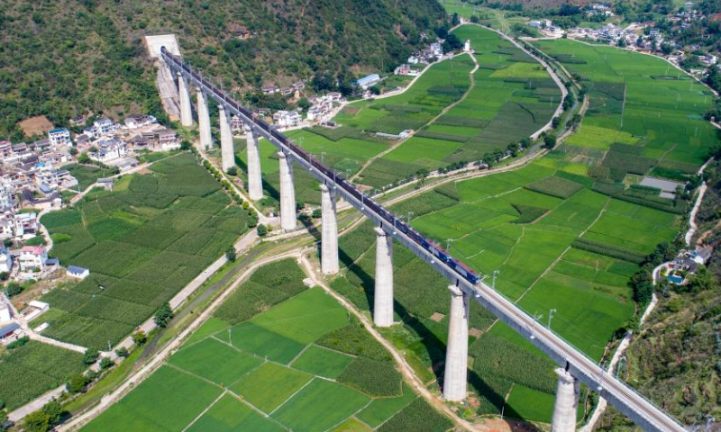 Aerial photo taken on July 22, 2022 shows a Fuxing bullet train running on a bridge in the Dali-Baoshan section of the Dali-Ruili Railway in southwest China's Yunnan Province. Baoshan in southwest China's Yunnan Province is no longer a city without rail links after the Dali-Baoshan section of the Dali-Ruili Railway officially went into operation on Friday. Photo: Xinhua