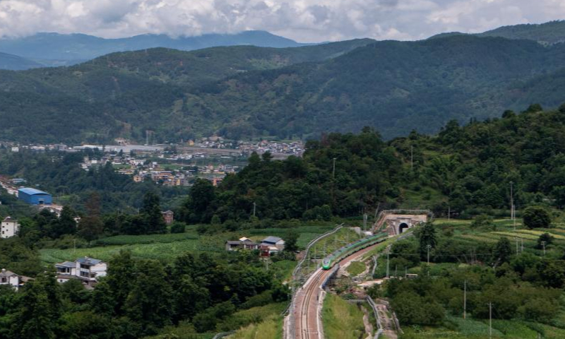 Aerial photo taken on July 22, 2022 shows a Fuxing bullet train running on a bridge in the Dali-Baoshan section of the Dali-Ruili Railway in southwest China's Yunnan Province. Baoshan in southwest China's Yunnan Province is no longer a city without rail links after the Dali-Baoshan section of the Dali-Ruili Railway officially went into operation on Friday. Photo: Xinhua