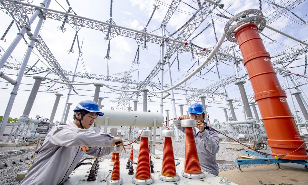 Technicians carry out a voltage resistance test at the 500-kilovolt (kV) Zipong power substation in Feixi county, East China's Anhui Province, on July 27, 2022. The substation is scheduled to be put into operation in September. It is the first 500 kV intelligent green substation in Feixi county. Photo: cnsphoto