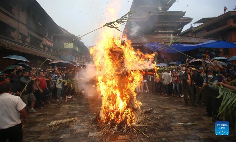 People observe the Ghantakarna Festival in Bhaktapur, Nepal, July 26, 2022. Members of the Newar community in the Kathmandu Valley observe the festival to chase away evil spirits and usher in good fortune. (Photo by Sulav Shrestha/Xinhua)