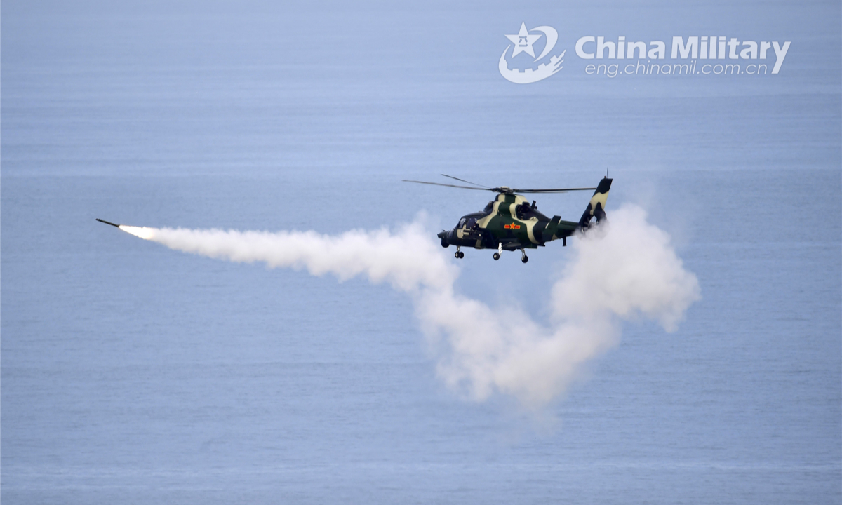 An attack helicopter attached to an army aviation brigade under the PLA 73rd Group Army fires at simulated targets in a maritime live firing training exercise staged by the brigade on July 19, 2022. Photo:China Military