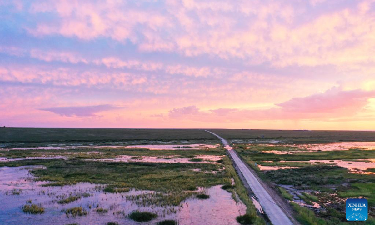 Aerial photo taken on July 27, 2022 shows the sunset scenery of a grassland in East Ujimqin Banner of Xilingol League, north China's Inner Mongolia Autonomous Region. Photo:Xinhua