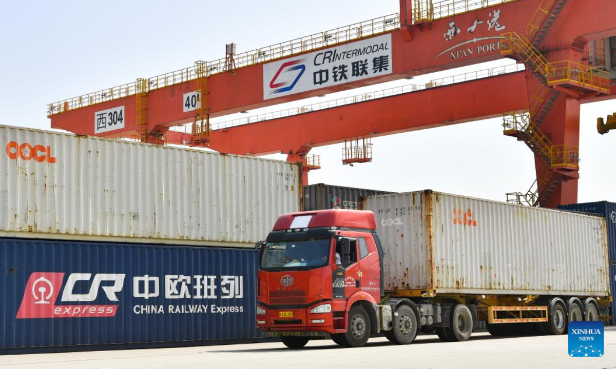 A truck transports containers at Xi'an International Port in Xi'an, northwest China's Shaanxi Province, July 29, 2022. At present, Xi'an has 16 main freight train routes to Europe, passing through 45 countries and regions along the Belt and Road. Photo:Xinhua