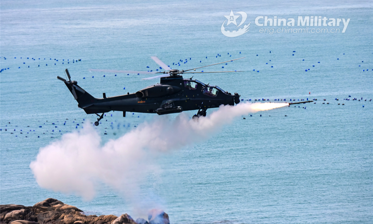 An attack helicopter attached to an army aviation brigade under the PLA 73rd Group Army fires at simulated targets in a maritime live firing training exercise staged by the brigade on July 19, 2022. Photo:China Military