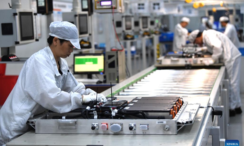 Workers work on a power battery production line at a workshop of a battery production company in Hefei Economic and Technological Development Area in Hefei, east China's Anhui Province, July 29, 2022. Photo: Xinhua 