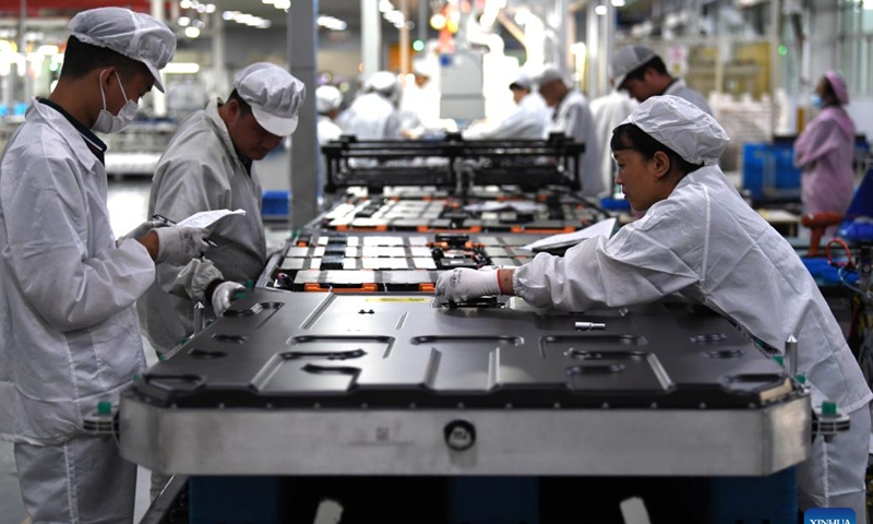 Workers work on a power battery production line at a workshop of a battery production company in Hefei Economic and Technological Development Area in Hefei, east China's Anhui Province, July 29, 2022. Photo: Xinhua 