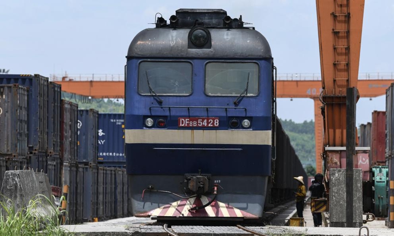 Photo taken on July 29, 2022 shows an outbound freight train at a railway freight center in Wuzhou, south China's Guangxi Zhuang Autonomous Region. Launched in 2017, the New International Land-Sea Trade Corridor is a trade and logistics passage jointly built by western Chinese provinces and ASEAN countries. (Xinhua/Zhang Ailin)