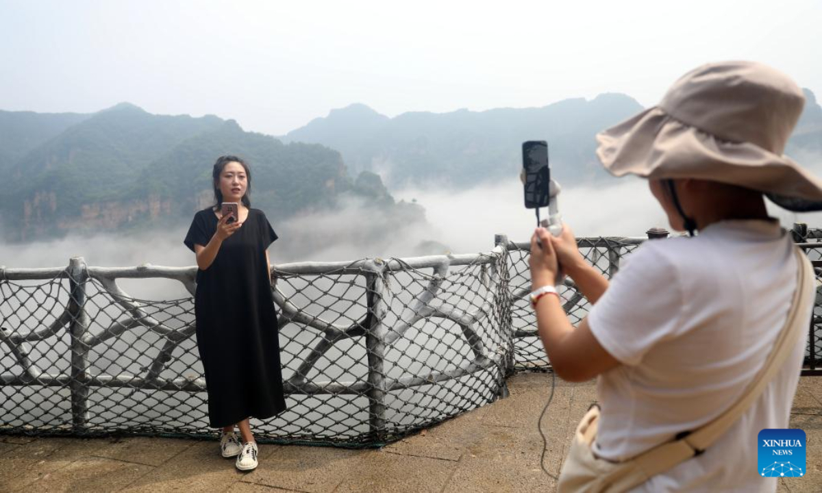 Aerial photo taken on Aug. 4, 2022 shows the mist-shrouded Xinglong Mountain in Chengde City, north China's Hebei Province. Photo:Xinhua