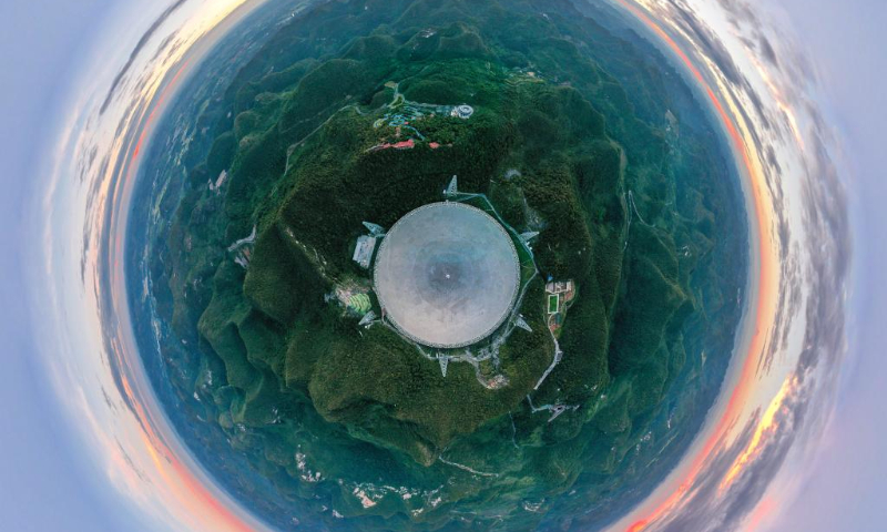 Aerial photo taken on Aug. 28, 2019 shows a panoramic view of China's Five-hundred-meter Aperture Spherical Radio Telescope (FAST) in southwest China's Guizhou Province.

Located in a naturally deep and round karst depression in southwest China's Guizhou Province, FAST started formal operation in January 2020 and officially opened to the world on March 31, 2021. It is believed to be the world's most sensitive radio telescope. With FAST, scientists have identified over 660 new pulsars. (Xinhua/Ou Dongqu)