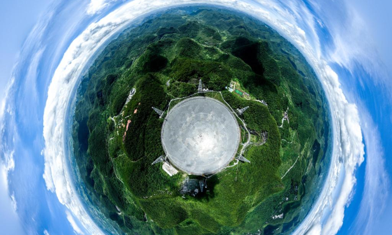 Aerial panoramic photo taken on July 21, 2022 shows China's Five-hundred-meter Aperture Spherical Radio Telescope (FAST) under maintenance in southwest China's Guizhou Province. Located in a naturally deep and round karst depression in southwest China's Guizhou Province, FAST started formal operation in January 2020 and officially opened to the world on March 31, 2021. It is believed to be the world's most sensitive radio telescope. With FAST, scientists have identified over 660 new pulsars. (Xinhua/Ou Dongqu)