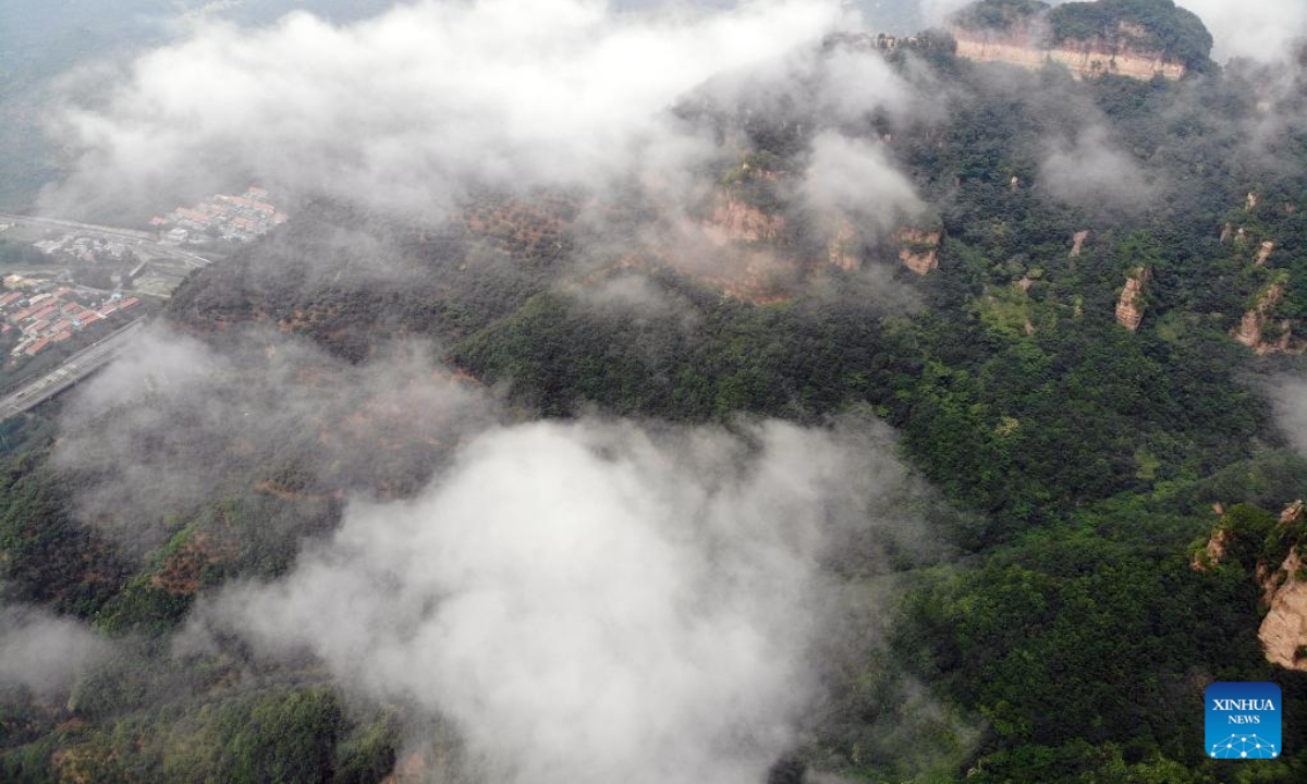 Aerial photo taken on Aug. 4, 2022 shows the mist-shrouded Xinglong Mountain in Chengde City, north China's Hebei Province. Photo:Xinhua