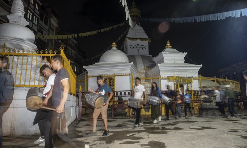 People play traditional music in celebration of the Gunla Festival in Lalitpur, Nepal, July 29, 2022. The festival is one of the major festivals for the Newar Buddhist community during which people recite scriptures, observe fast and visit places of worship.(Photo: Xinhua)