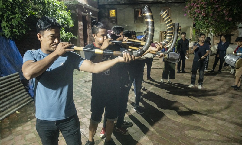 People play traditional music in celebration of the Gunla Festival in Lalitpur, Nepal, July 29, 2022. The festival is one of the major festivals for the Newar Buddhist community during which people recite scriptures, observe fast and visit places of worship.(Photo: Xinhua)