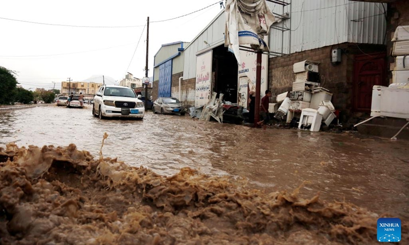 Vehicles run on a flooded street after heavy rain in Sanaa, Yemen, on Aug. 1, 2022.(Photo: Xinhua)