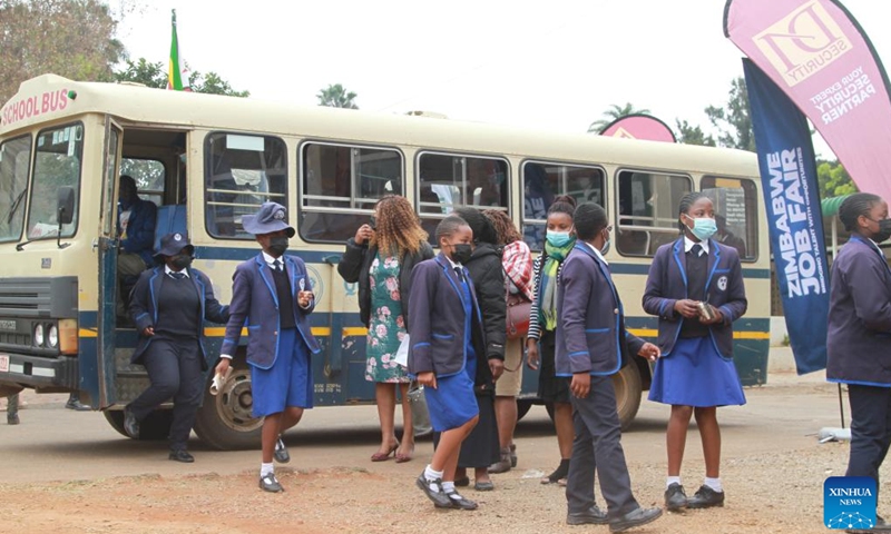 High school students seeking career guidance arrive to attend a job fair in Harare, Zimbabwe, on Aug. 2, 2022. The two-day Zimbabwe Job Fair opened Tuesday. Hosted by the China Africa Economic and Culture Exchange Research Center and Victory Milestone Recruitment, the event lived up to its billing as scores of job seekers exchanged notes with potential employers and left the curriculum vitae (CV) for possible placements.(Photo: Xinhua)