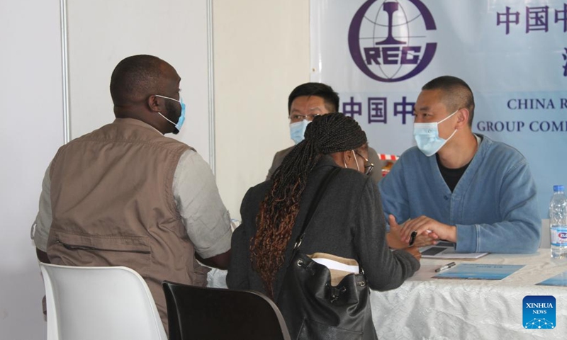 Job seekers communicate with potential employers at a job fair in Harare, Zimbabwe, on Aug. 2, 2022. The two-day Zimbabwe Job Fair opened Tuesday. Hosted by the China Africa Economic and Culture Exchange Research Center and Victory Milestone Recruitment, the event lived up to its billing as scores of job seekers exchanged notes with potential employers and left the curriculum vitae (CV) for possible placements.(Photo: Xinhua)