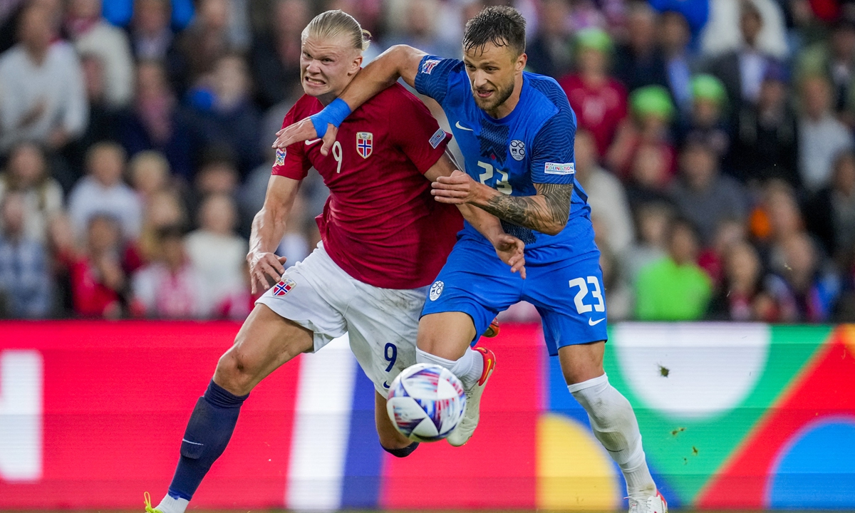 Norway's forward Erling Haaland (left) and Slovenia's defender David Brekalo vie for the ball during the UEFA Nations League soccer match in Oslo, Norway on June 9, 2022. Photo: AFP 