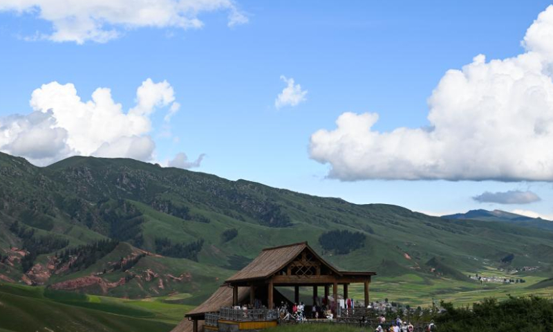 Tourists visit Zhuo'er Mountain scenic area in Qilian County of Haibei Tibetan Autonomous Prefecture, northwest China's Qinghai Province, Aug. 10, 2022. (Xinhua/Zhang Long)