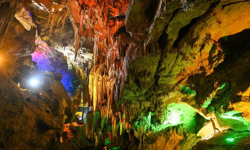 Colored lights illuminate the geological formations at the Benxi Water Cave, a large-scale underground karst, in Benxi, northeast China's Liaoning Province, Aug. 10, 2022. (Photo: China News Service/Yu Haiyang)

Developed about 500,000 years ago, the cave has more than 400,000 cubic meters internal space and a total length of 5,800 meters. Comprising a dry cave and a water cave, it is the world's longest underground karst cave with water.