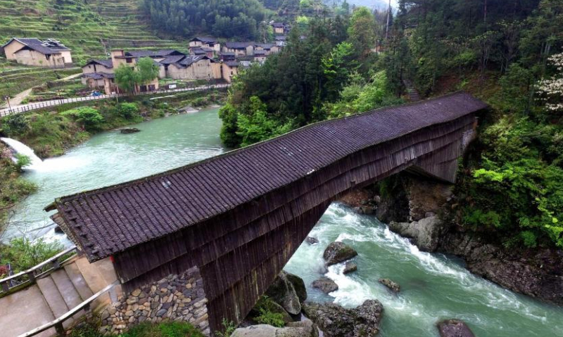 File photo shows the Luofeng wooden-roofed arch bridge in Xiadang town of Shouning county in Ningde, east China's Fujian Province. (Photo: China News Service/Wang Dongming)

Instead of using building materials such as nails, the bridges were built using the mortise and tenon joint process, a concavo-convex connection method used to combine two pieces of wood. Bridges built with the application of such techniques are able to withstand the hazards of flooding and stand strong even after 100 years of service.