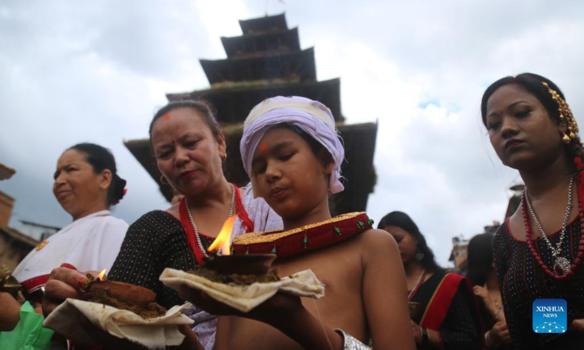 People take part in a parade during the Krishna Janmashtami festival in Bhaktapur, Nepal, Aug 19, 2022. Krishna Janmashtami festival is celebrated annually to mark the birth anniversary of Hindu God Krishna. Photo:Xinhua