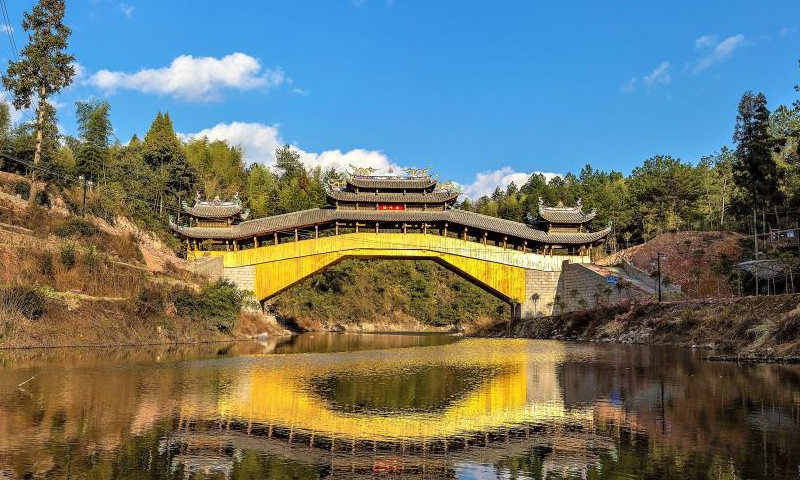 File photo shows the Shuanglong wooden-roofed arch bridge in Xietan town of Shouning county, Ningde, east China's Fujian Province. (Photo: China News Service/Gong Jian)